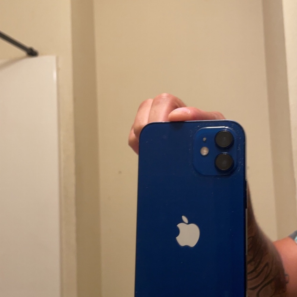 Blue IPhone 12 like new.